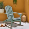 An outdoor seating area with a chair, plants, and a lantern. Anteprima dell’immagine prodotto