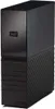 A black external hard drive is shown from a slight angle against a white background. Voir les images du produit