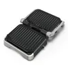 An open contact grill with ribbed plates, shown from a slightly elevated angle against a white background. Produktbild-Vorschau