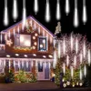 A house decorated with Christmas lights and decorations. Produktbild-Vorschau