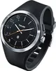A close-up studio shot of a black Beurer smartwatch with a silver bezel and a black rubber strap. Produktbild-Vorschau