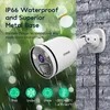 A white security camera mounted on a brick wall, with rain and bokeh effects in the background. Produktbild-Vorschau