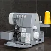A sewing machine is shown in a studio setting with a dark textured background. Produktbild-Vorschau