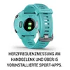 The back of a turquoise Garmin Forerunner 55 smartwatch, showing the heart rate sensor and charging contacts. Podgląd zdjęcia produktu
