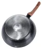 The underside of a frying pan with a wooden handle is shown against a white background. Náhled obrázku produktu