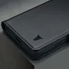 A close-up of a black leather phone case with a bull logo. Produktbild-Vorschau