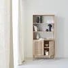 A wooden bookshelf with rattan doors, decorated with various items. Produktbild-Vorschau