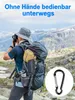 A person is hiking in the mountains and taking a photo. Produktbild-Vorschau