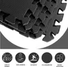A stack of black interlocking foam mats with icons and text describing their features. Produktbild-Vorschau