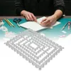 A person's hands are shown crafting with paper and cutting dies on a green cutting mat. Náhled obrázku produktu