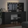 A vanity table with a mirror and lights, a stool, and shelves, set in a room. Produktbild-Vorschau