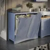 A laundry cabinet with two baskets in a bathroom setting. Produktbild-Vorschau