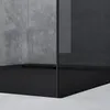 A close-up view of a modern shower enclosure with a black base and a gray concrete wall. Produktbild-Vorschau