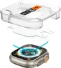 A screen protector kit for an Apple Watch Ultra, showing the watch, the screen protector, and the application tool. Podgląd zdjęcia produktu