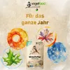 A marketing image for bird food, featuring seasonal imagery and a bag of bird feed. Produktbild-Vorschau