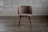 A single chair against a concrete wall and wooden floor. Produktbild-Vorschau