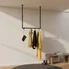 A minimalist entryway with a ceiling-mounted clothes rack, a wooden bench, and a rug. Produktbild-Vorschau