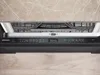 The front panel of an integrated Siemens dishwasher, showing the control panel with various icons and a digital timer. Náhled obrázku produktu