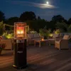 A patio heater is lit on a wooden deck at night, with outdoor furniture and string lights in the background. Produktbild-Vorschau
