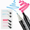 Close-up of two markers with ink lines drawn on a white background. Produktbild-Vorschau