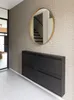 A hallway with a shoe cabinet and a mirror. Produktbild-Vorschau