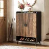 An entryway with a shoe cabinet, umbrella stand, and a door. Náhľad obrázku produktu