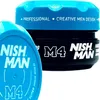 Two containers of hair styling product, one in the foreground and one in the background. Náhľad obrázku produktu