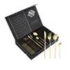 A set of gold cutlery in a black gift box. Produktbild-Vorschau