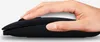 A hand is shown holding a black wireless computer mouse. Produktbild-Vorschau