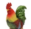 A close-up studio shot of a colorful rooster figurine. Produktbild-Vorschau