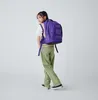 A young person wearing a backpack. Náhľad obrázku produktu