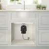 A garbage disposal unit installed under a kitchen sink. Produktbild-Vorschau