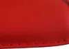 A close-up shot of a red leather material with visible stitching. Náhled obrázku produktu