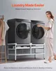 A woman stands next to a washing machine stand with two washing machines on it. Clothes are hanging on a rack to the left. Voir les images du produit