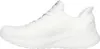 A side view of a white Skechers sneaker. Voir les images du produit