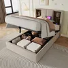 A bed with its storage compartment open, revealing stored items, in a bedroom setting. Anteprima dell’immagine prodotto
