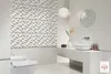 A modern, minimalist bathroom with a textured feature wall, a floating vanity with a vessel sink, and a toilet. Náhled obrázku produktu