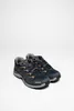 A pair of low-cut hiking shoes on a white background. Voir les images du produit