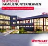 A modern office building with a pond in front, under a twilight sky. Produktbild-Vorschau