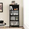 A black metal shelving unit with glass doors, filled with books and decorative items, stands against a light-colored wall next to a window with blinds. Produktbild-Vorschau