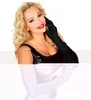 A woman wearing black gloves and a black dress, with white gloves shown below. Produktbild-Vorschau