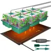 A set of mini greenhouses with plants, sitting on a heating mat, with a controller and gardening tools. Náhled obrázku produktu