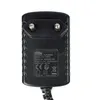 A close-up shot of a black AC/DC adapter with text and symbols on the back. Produktbild-Vorschau