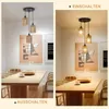 A split image showing a dining room with a pendant light fixture above a table. The left side shows the light off, and the right side shows it on. Produktbild-Vorschau