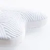 A close-up, studio shot of a white and light blue pillow with a textured, wavy pattern. Produktbild-Vorschau