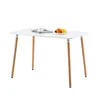 A white rectangular dining table with four wooden legs, set against a white background. A small plate with fruit and a cup of coffee are on the table. Voir les images du produit