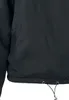 A close-up view of the bottom hem of a black jacket, showing drawstrings and grommets. Produktbild-Vorschau