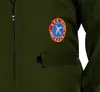 A close-up of a green jacket with an embroidered patch. Anteprima dell’immagine prodotto