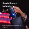 A hand holding a small black device with a blue light, plugged into a larger black device, with blurred red lights in the background. Náhled obrázku produktu