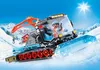 A snow groomer with a driver is shown on a snowy slope with mountains and a ski lift in the background. Podgląd zdjęcia produktu